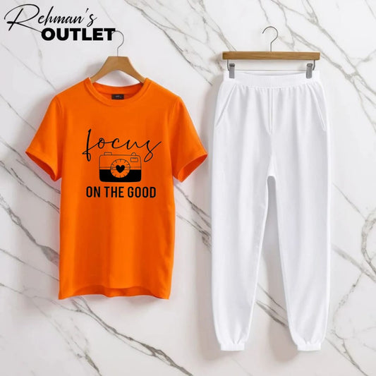 orange tee with focus on the good white trouser